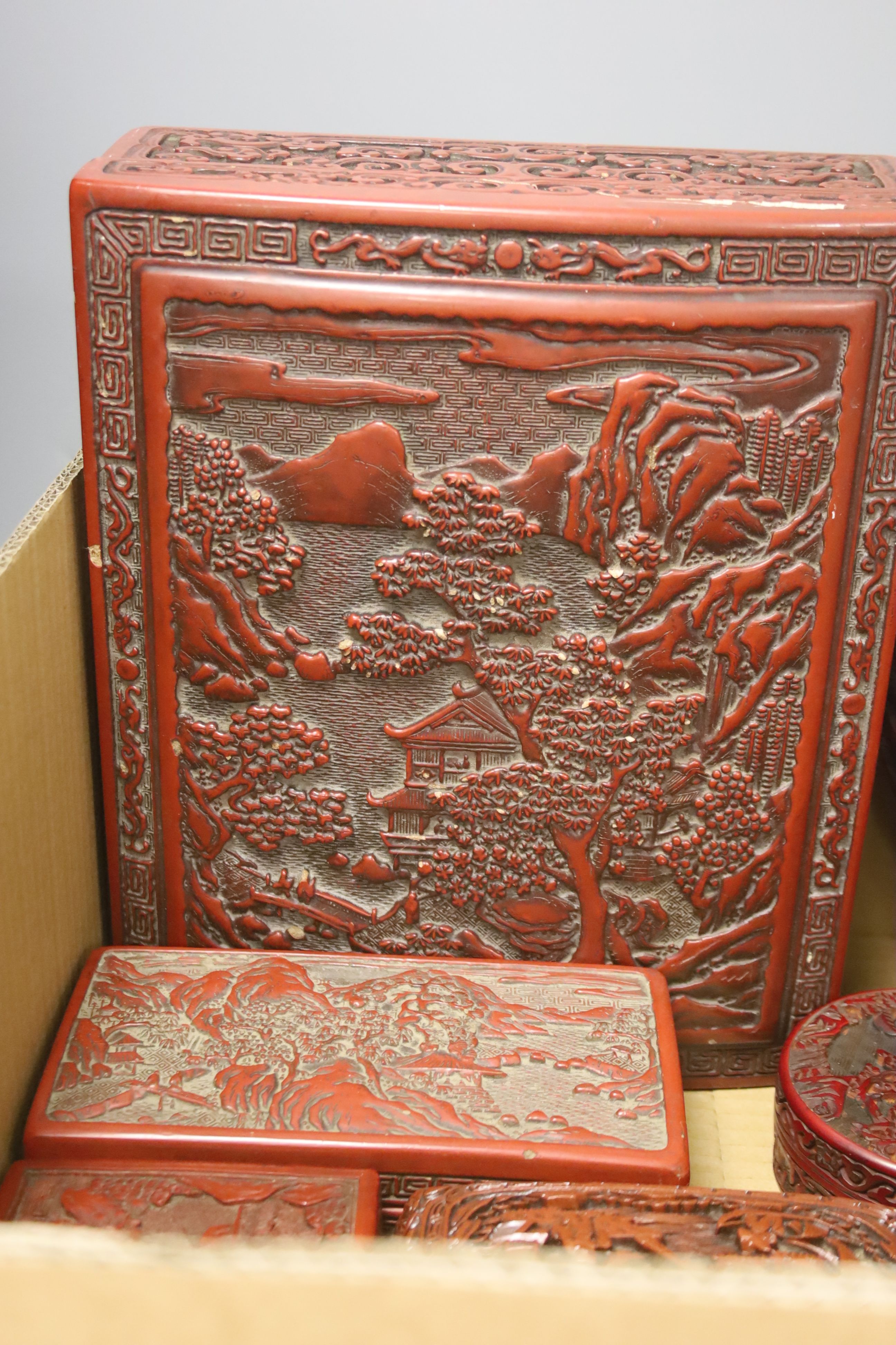 An assortment of Chinese cinnabar lacquer and other later boxes, largest 29 x 10cm